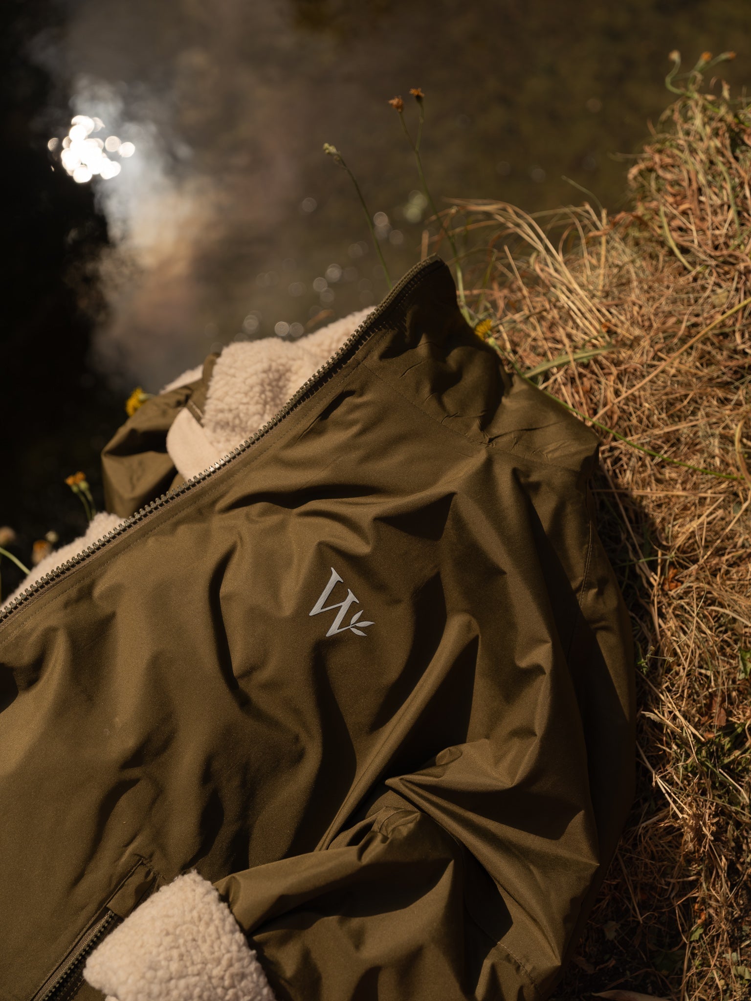 Countryside robe on the ground by a stream